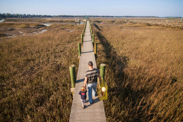 father and son going crabbing, overhead view