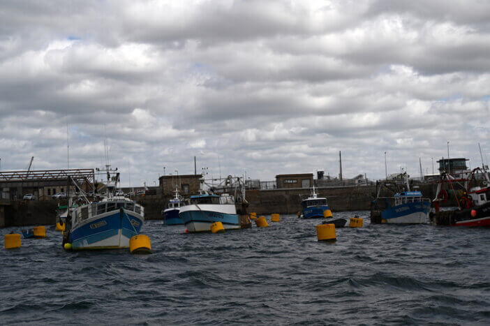 Saint-Malo, France, May 11, 2022: Trawlers moored in the fishing port of Saint-Malo