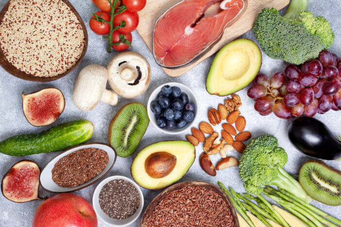 pescetarian diet. products for a healthy diet: fish, cereals, vegetables, berries, nuts. top view