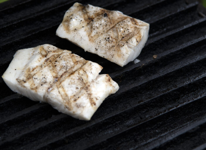 FRESG COD FILETS ON GRILL.