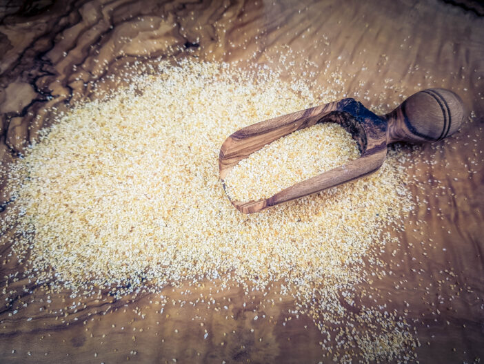 Garlic granules on olive wood