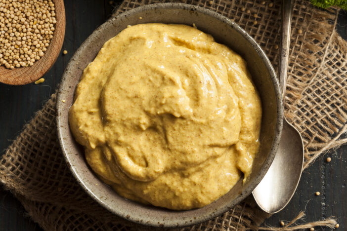 Homemade Spicy Mustard Sauce on a Background