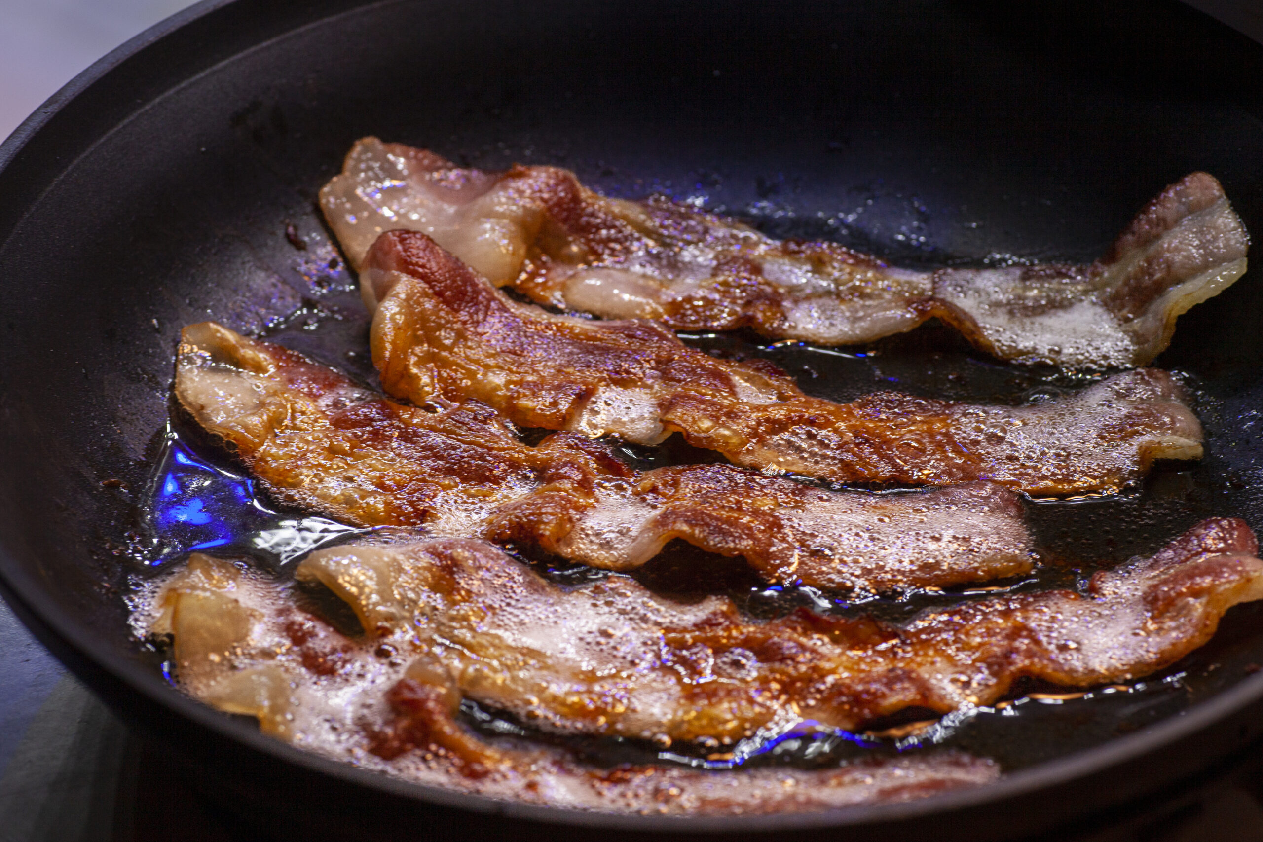 BACON FRYING IN A PAN