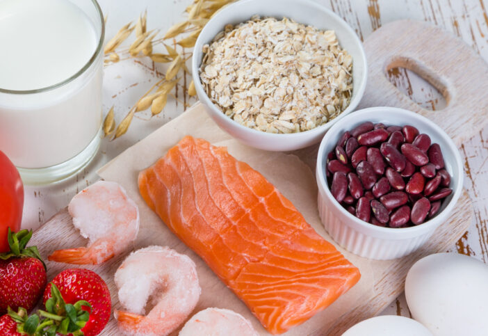 Food allergies - food concept with major allergens, rustic wood background