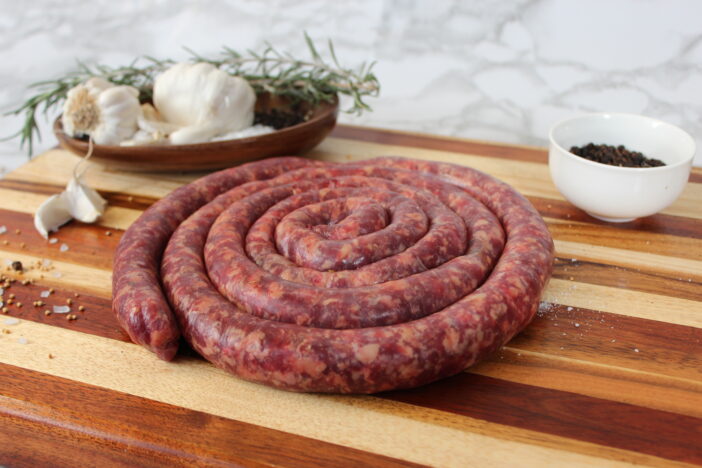 Raw beef boerewors with garnish