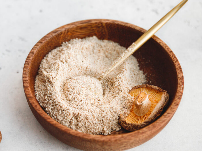 Rowder is made from Chinese dried mushrooms Shiitake in a wooden bowl on a table. The concept of medicinal additive for healthy food.