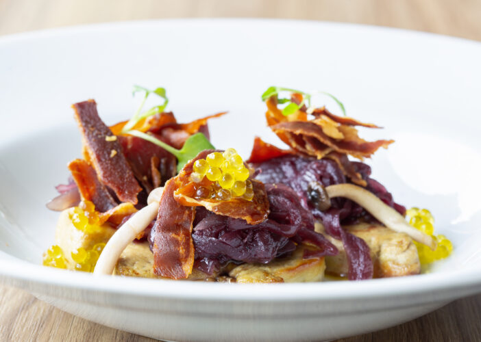 Fresh foie with red wine onion, Iberian ham chips, seasonal mushrooms and extra virgin olive oil pearls