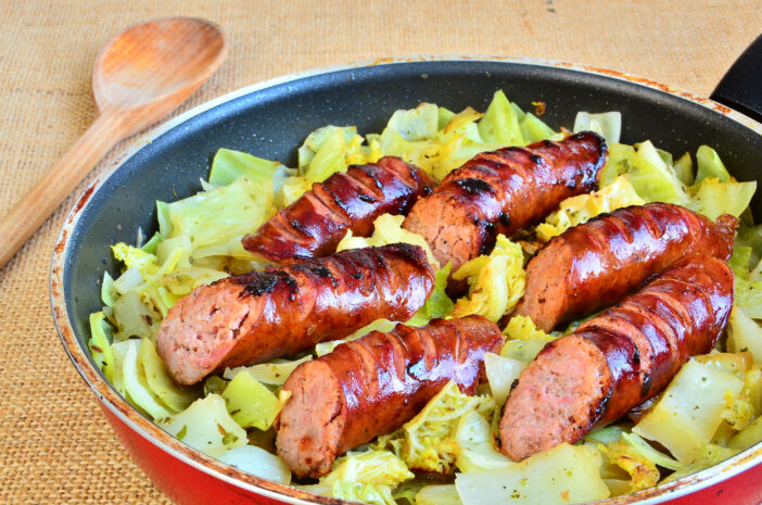 Polish pork kielbasa simmered with white cabbage with onions, garlic, caraway, marjoram and other herbs