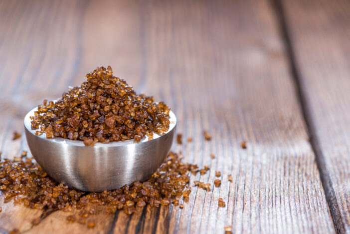 Portion of Smoked Salt on wooden background