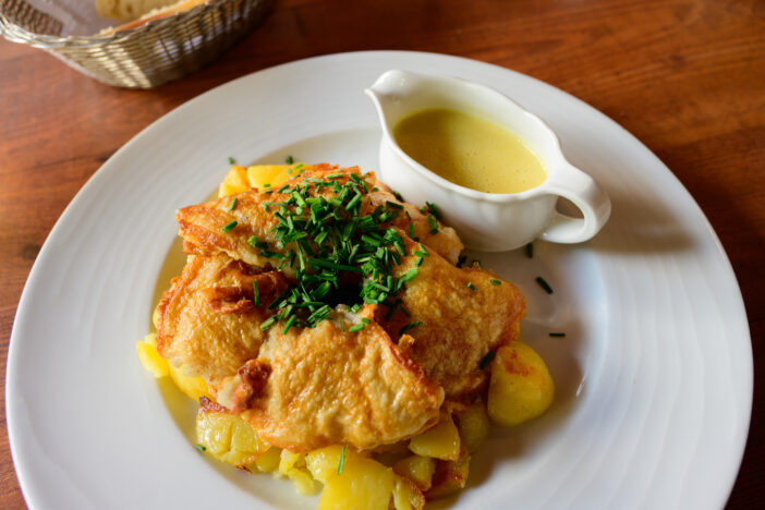 Hamburger Pannfisch, a Traditional Dish from Hamburg with Fried Fish, Roast Potatoes and a Mustard Sauce