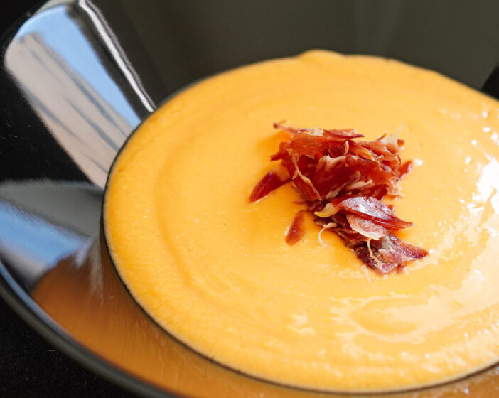 Salmorejo served with jamón, refreshing Spanish tomato cold soup from Cordoba, Andalusia, Spain