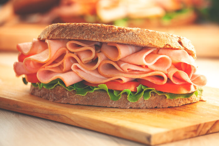 Sandwich with smoked ham and fresh lettuce