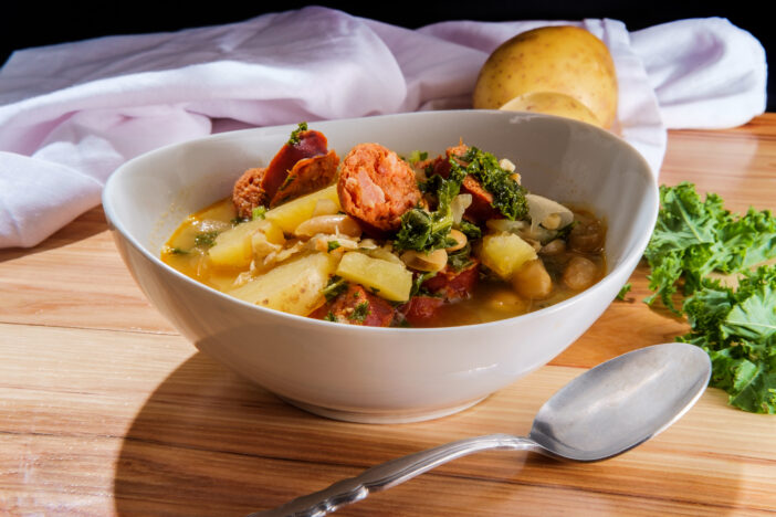 Traditional Portuguese caldo verde linguica sausage soup with kale and yukon gold potatoes