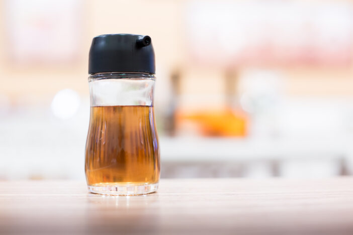 a bottle of fish sauce on the table