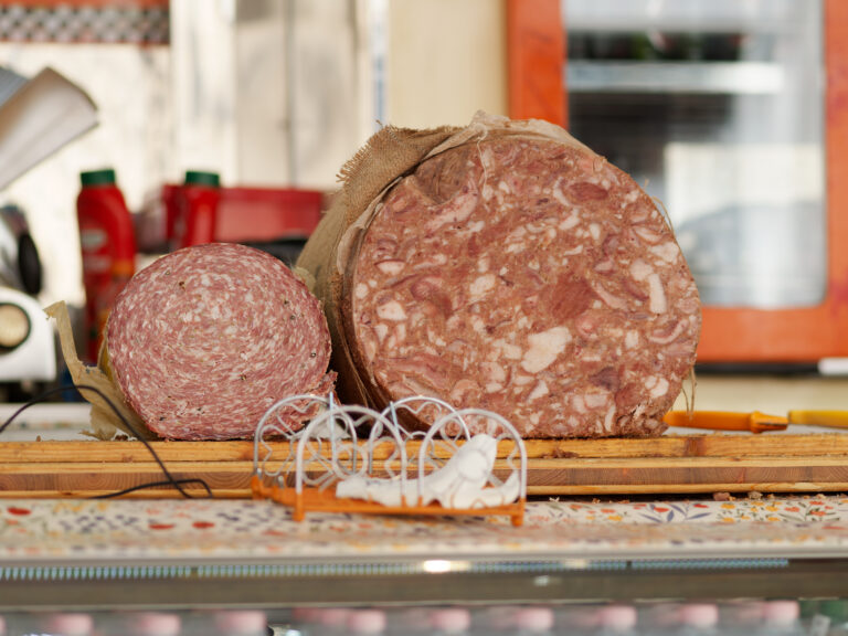 finocchiona and sopressata salami in a market in italy