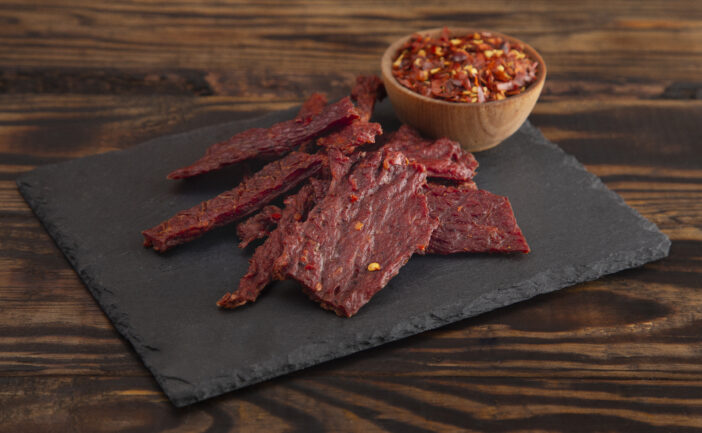 A Pile Hot and Spicy Beef Jerky with Red Pepper Flakes