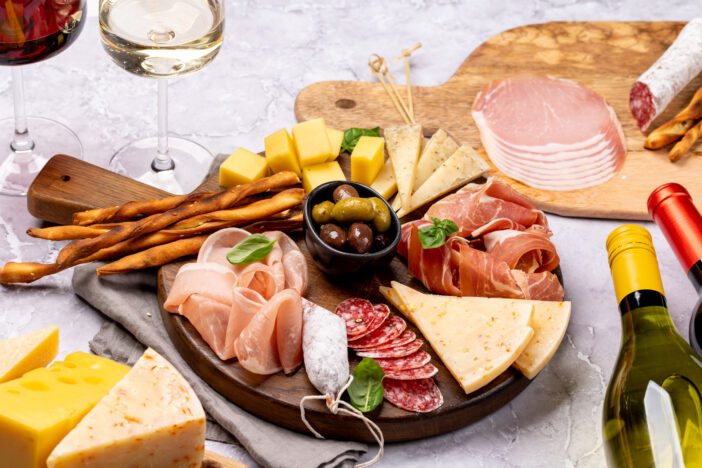 Antipasto board with various meat and cheese snacks