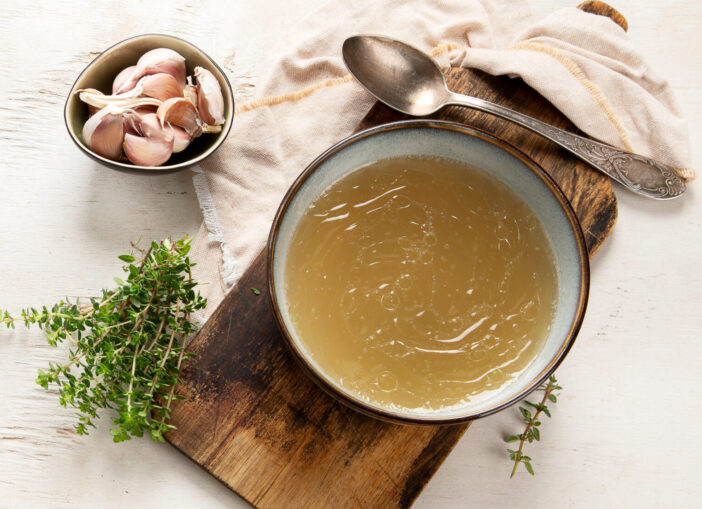 Broth in Bowl on gray background, healthy food, top view, copy space, panorama, banner,