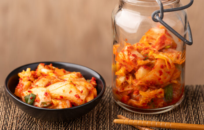 Fresh, homemade kimchi in a bowl and jar