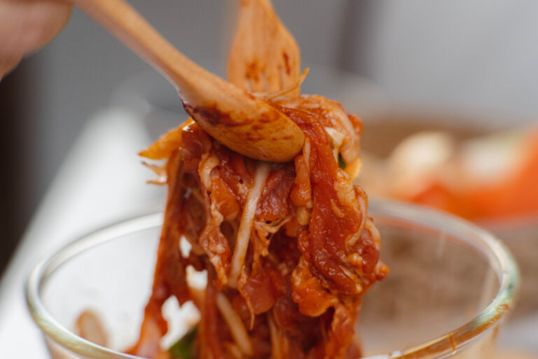 Step-by-step procedures to marinate pork for easy Korean cooking, add chopped onions and Japanese bunching onion, sesame oil, soy sauce, Korean gochujang and mix well. Korean homemade food for lunch