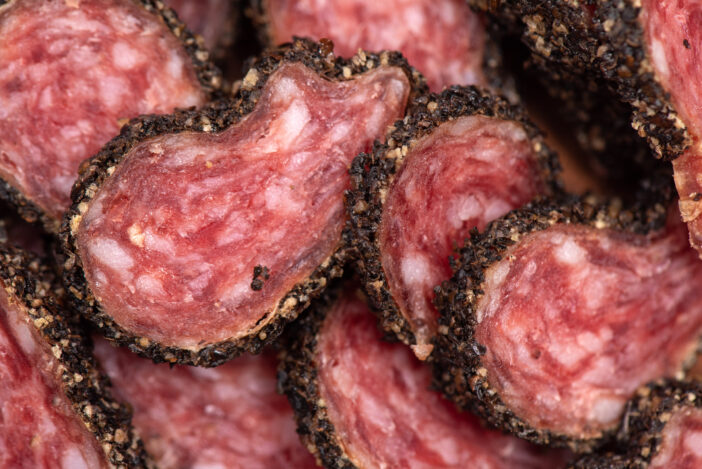 Sliced salami with a beautiful fat texture