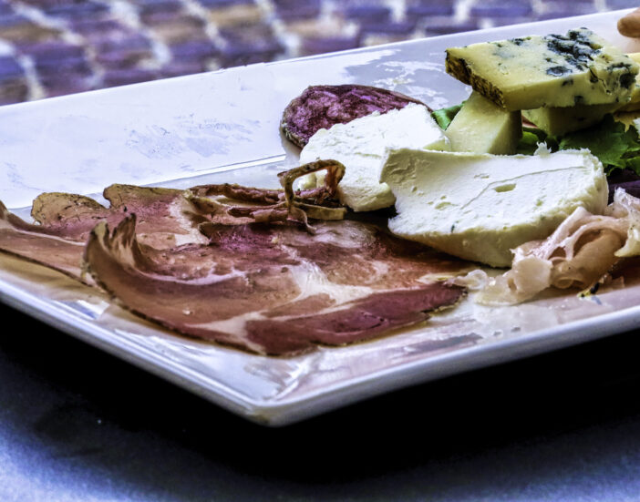 a platter of cold cuts and cheeses as an aperitif in Neive, in the Langhe