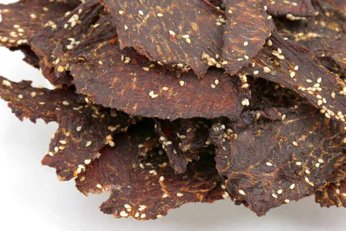 dried beef slices in spices with sesame seeds.  Healthy and vitamin food