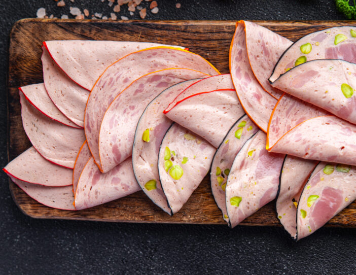 sausage with nuts meat plate delicious snack mortadella, pistachios, ham healthy meal food snack diet on the table