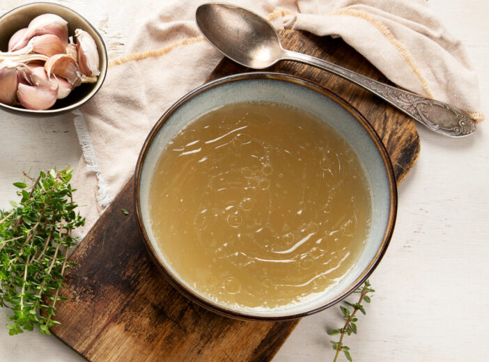 Broth in Bowl on gray background, healthy food, top view, copy space, panorama, banner,