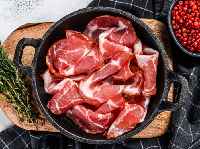 Coppa, Capocollo, Capicollo meat popular italian antipasto food.  White background. Top view.