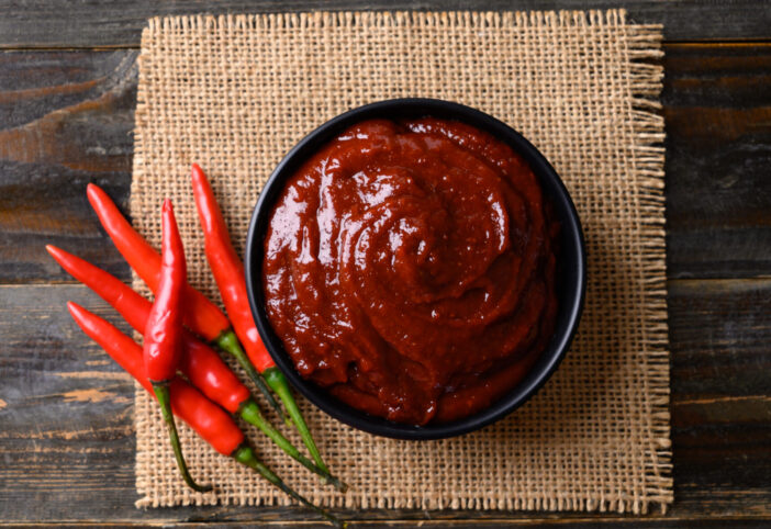 Gochujang (red chili paste), spicy and sweet fermented condiment in Korean food, Table top view