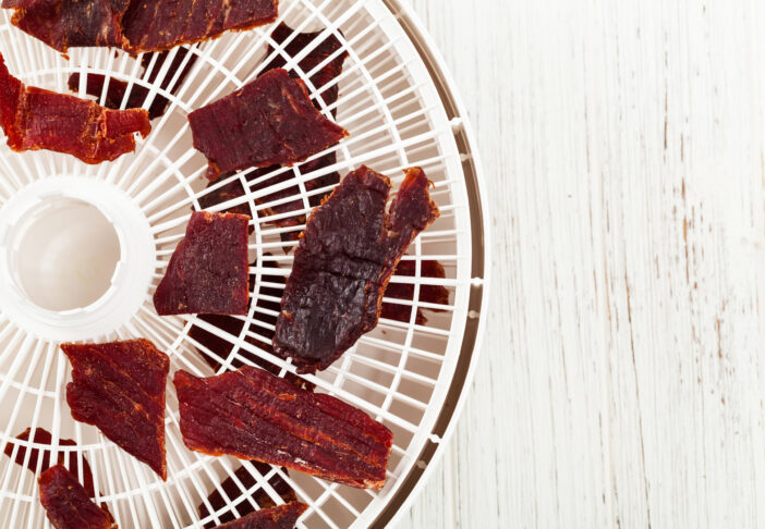 Homemade Beef Jerky with a dehydrator. Selective focus.