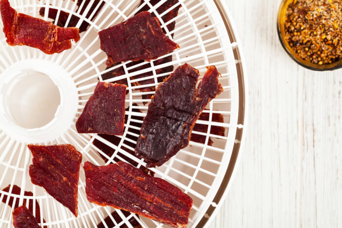 Homemade Beef Jerky with a dehydrator. Selective focus.