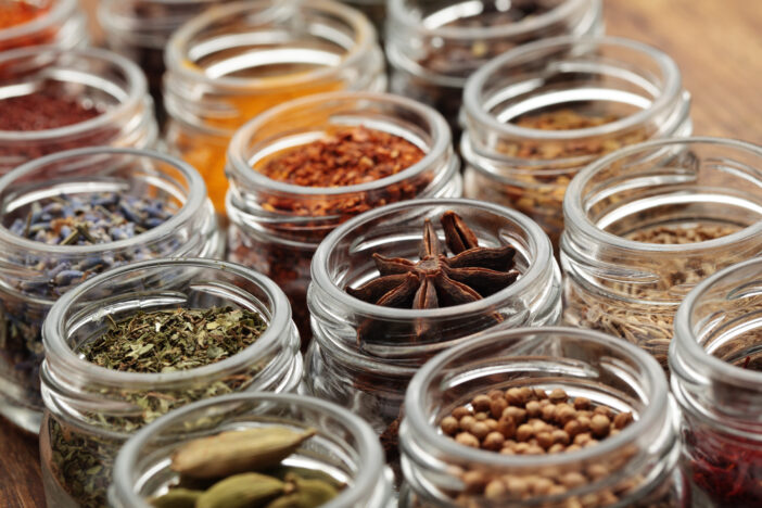 Rows of jars with various spices