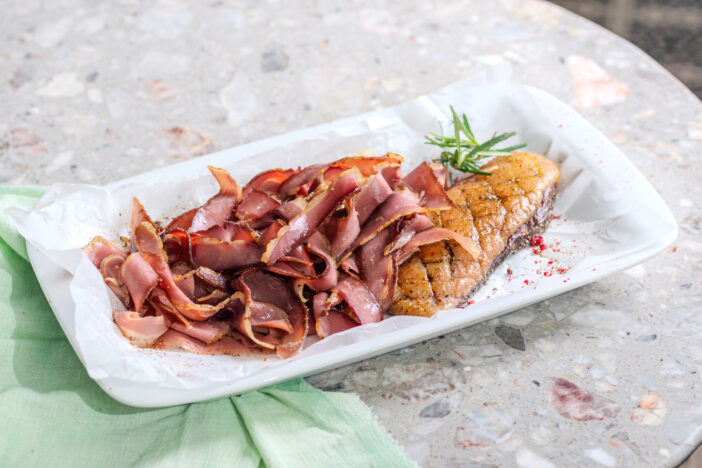 Plate of appetizing duck jamon served. Restaurant menu concept for the New Year. Christmas decoration.