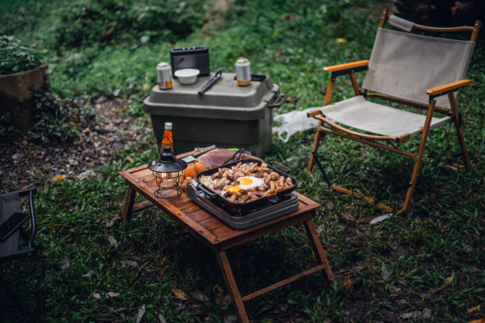 Fried eggs and grilled pork in a camping pan,camp food