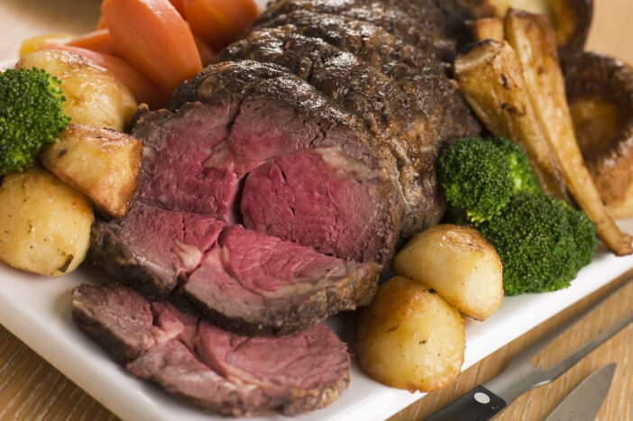 Roast Rib eye of British Beef with all the Trimmings on White Dish