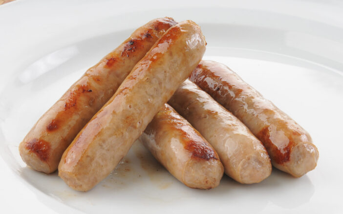 Close up of a plate of maple smoked link sausages