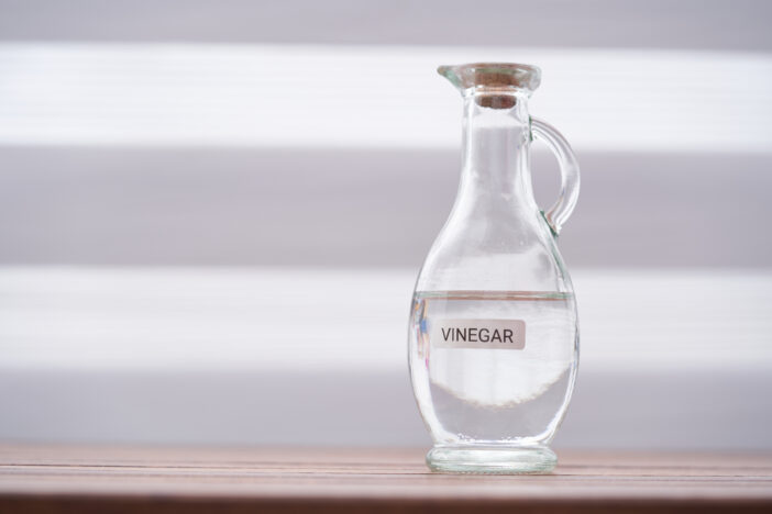 white vinegar on wood table top