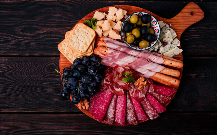 Appetizer, assortment, set, sausage, and cheese, on a wooden board, top view, no people,