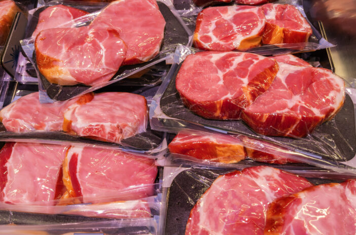 Assorted Fresh Raw Meat Cuts on Display at Butcher Shop