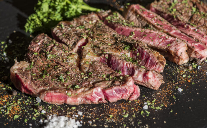 Grilled flat iron steak shot in flat lay style