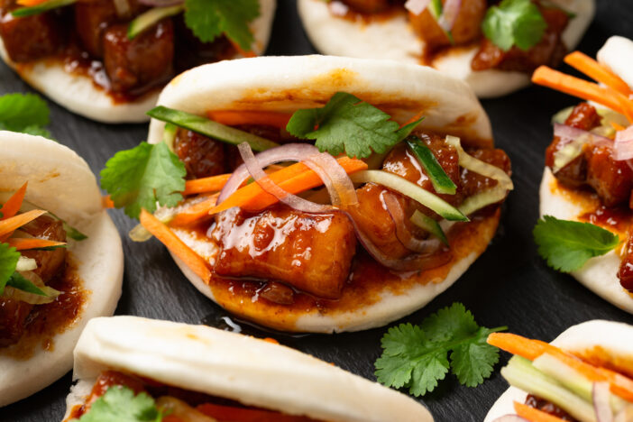 Bao buns with pork belly and vegetable. Asian cuisine.