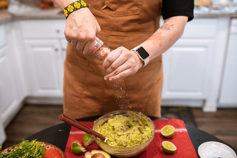 Man Salting Guacamole