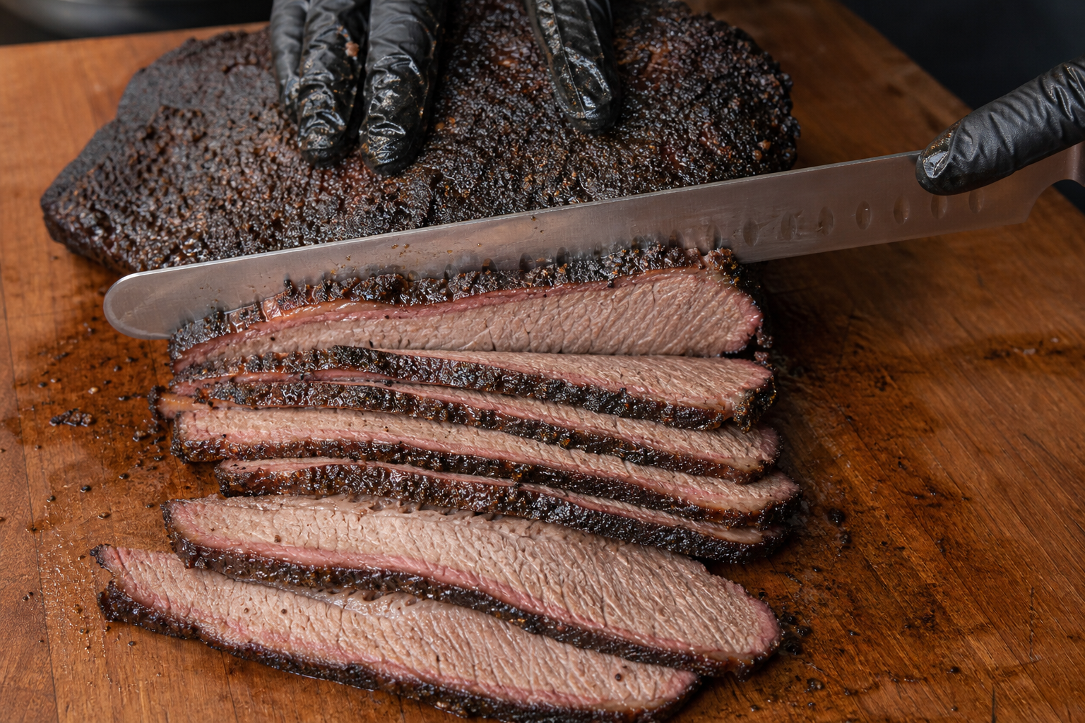 Brisket Flat vs Whole Packer: Which Should You Smoke? 9 Slicing smoked brisket against the grain with a knife on a cutting board
