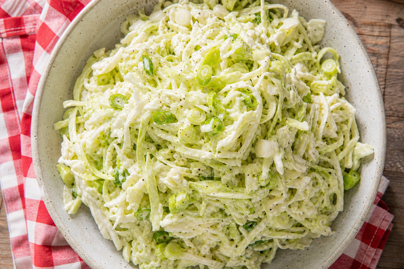10 Coleslaw Ideas That Go Beyond the Basics 14 Southern buttermilk coleslaw in a ceramic bowl with green cabbage and green onion slices