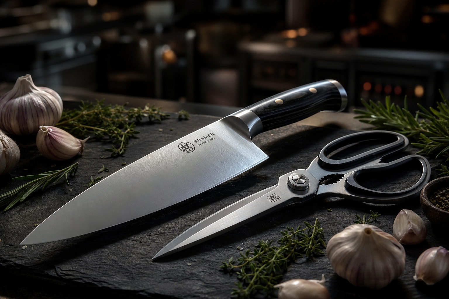 How to Break Down a Whole Chicken to Save Money 8 A sharp chef's knife and kitchen shears laid on a dark cutting board