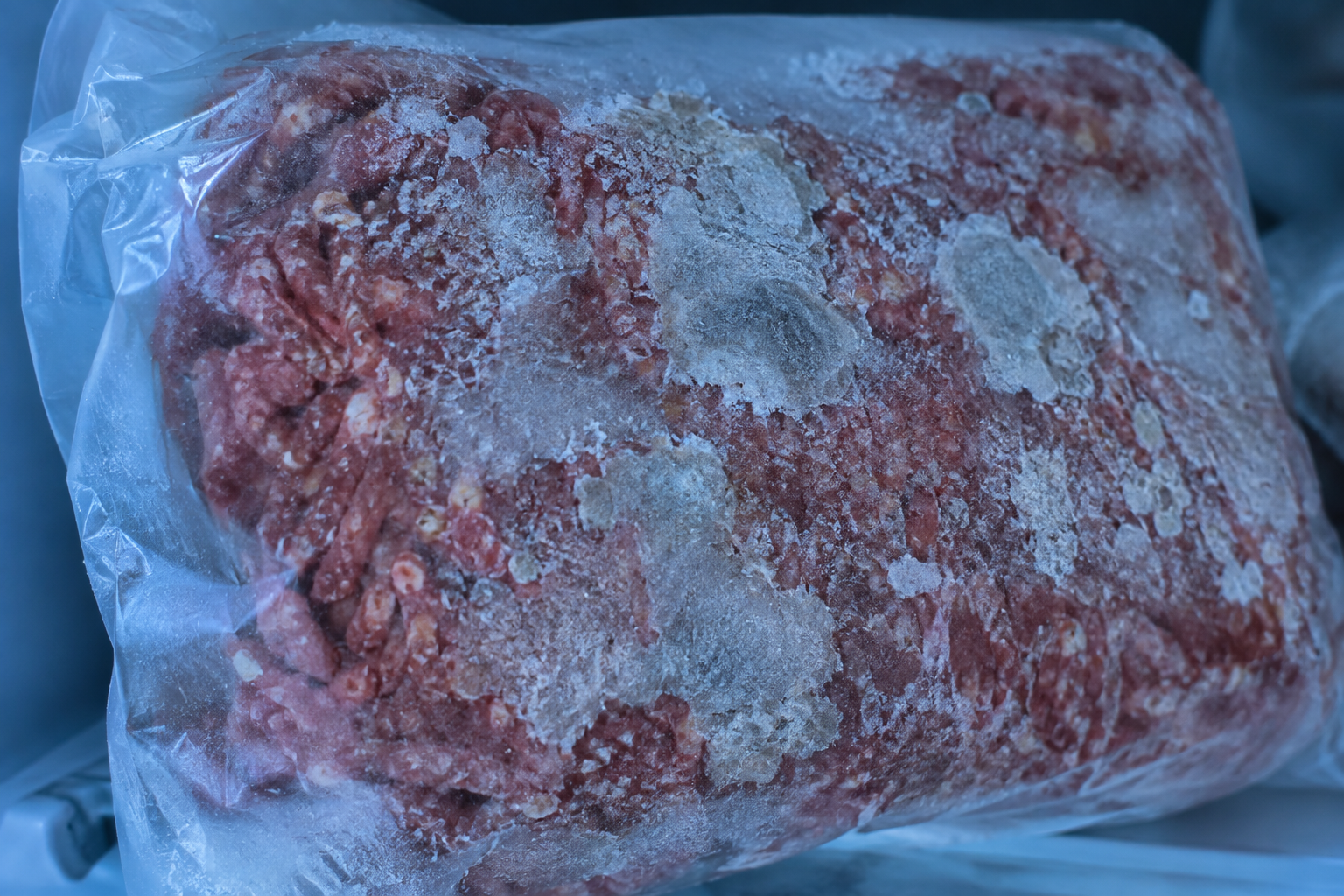 Why Is Ground Beef Brown Inside but Red Outside? 8 Ground beef showing signs of freezer burn with ice crystals and dry patches