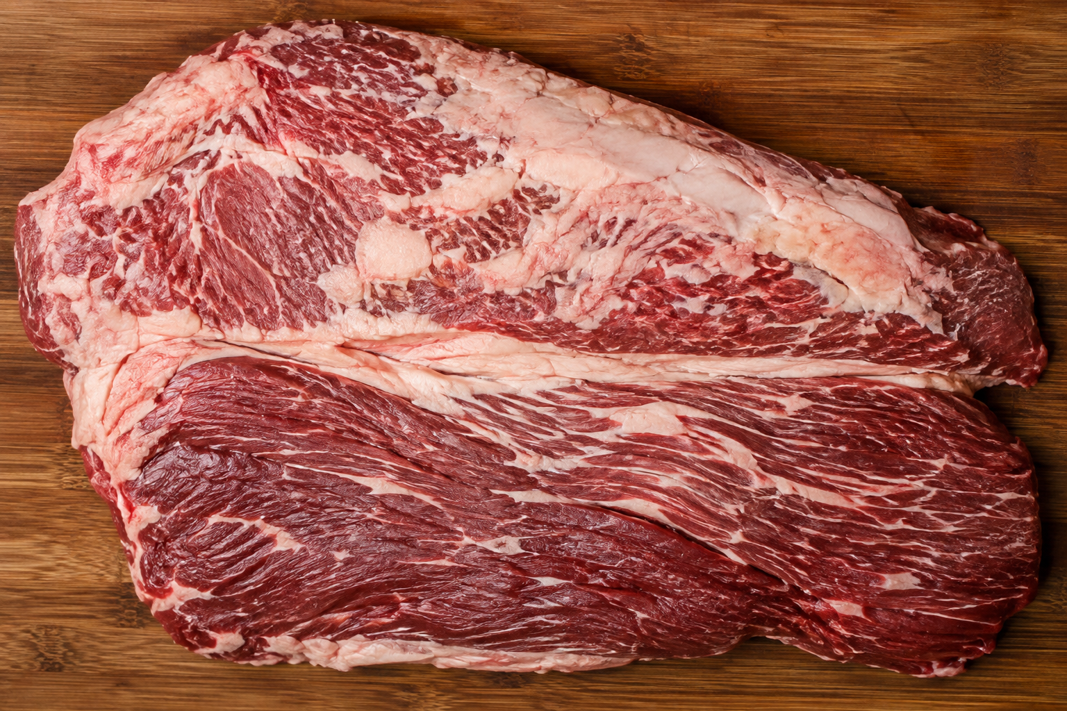 Whole packer brisket showing the point and flat sections separated