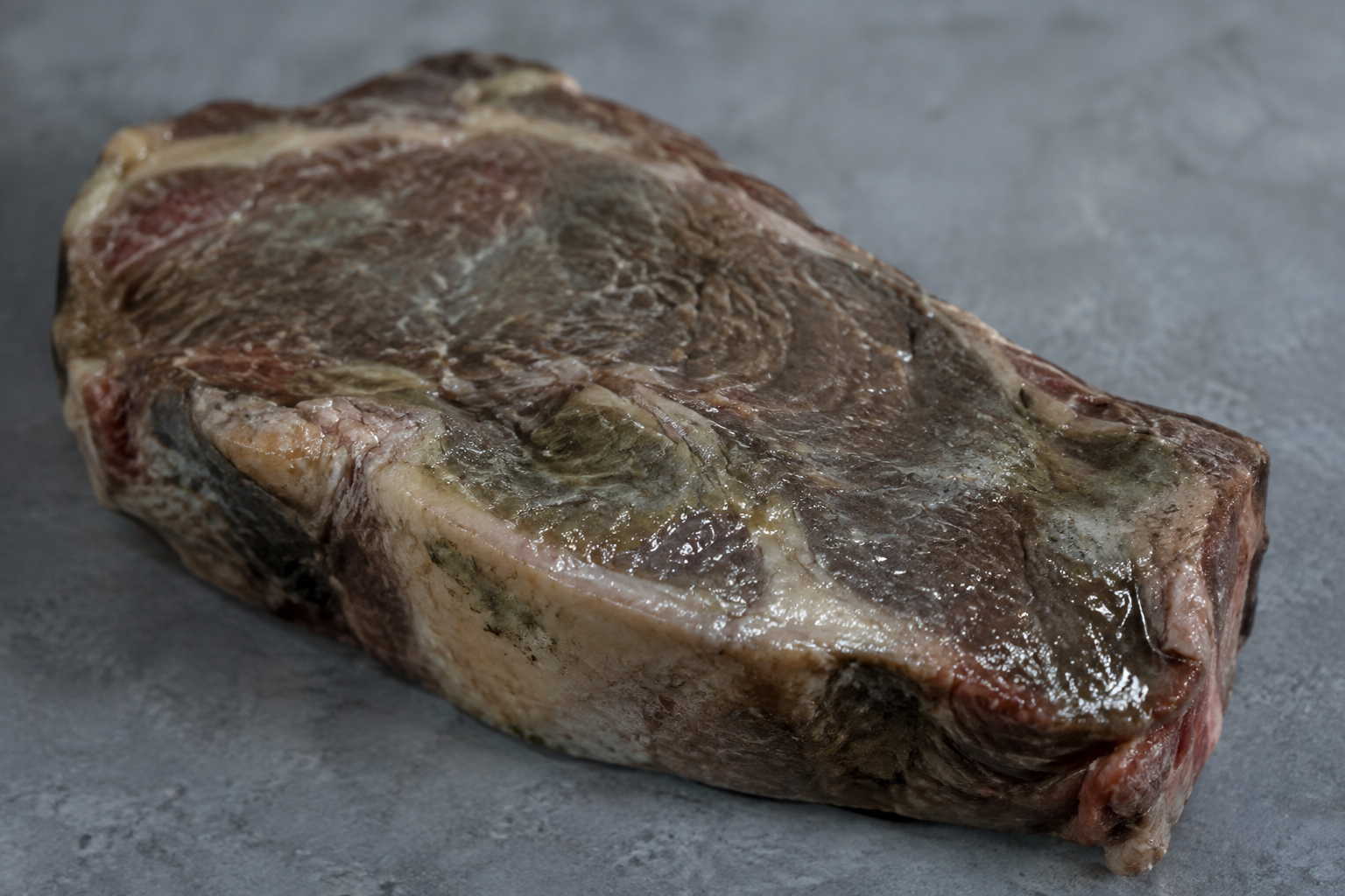 Why Is Steak Brown in the Fridge? When Color Is Normal and When It Isn't 7 Spoiled steak with grayish, slimy surface indicating it has gone bad